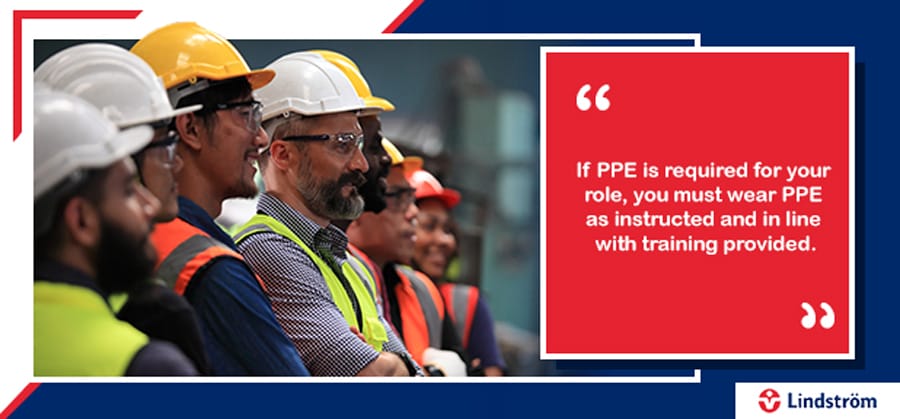 Workers in PPE attending safety briefing with training compliance quote.