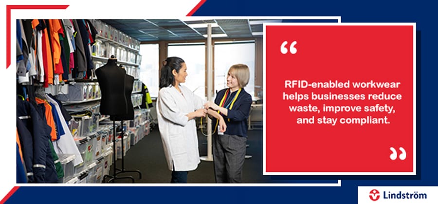 Staff measuring RFID-enabled workwear in uniform supply room for safety and compliance.